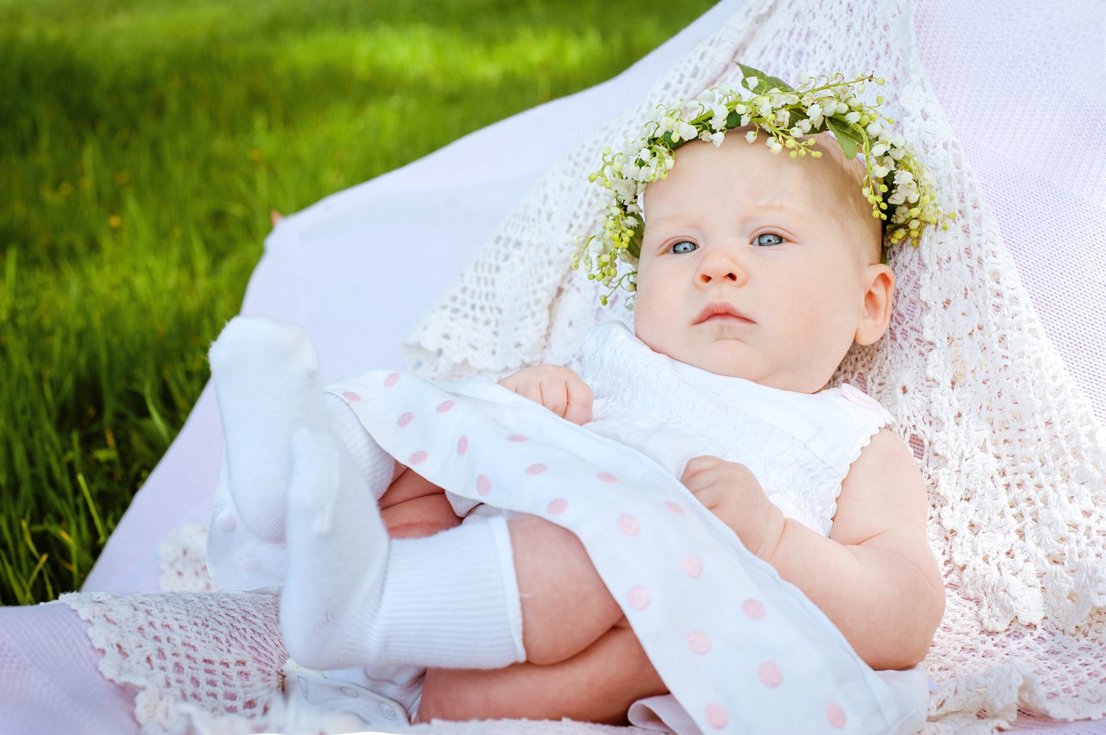 cute baby and flower lily of the valley