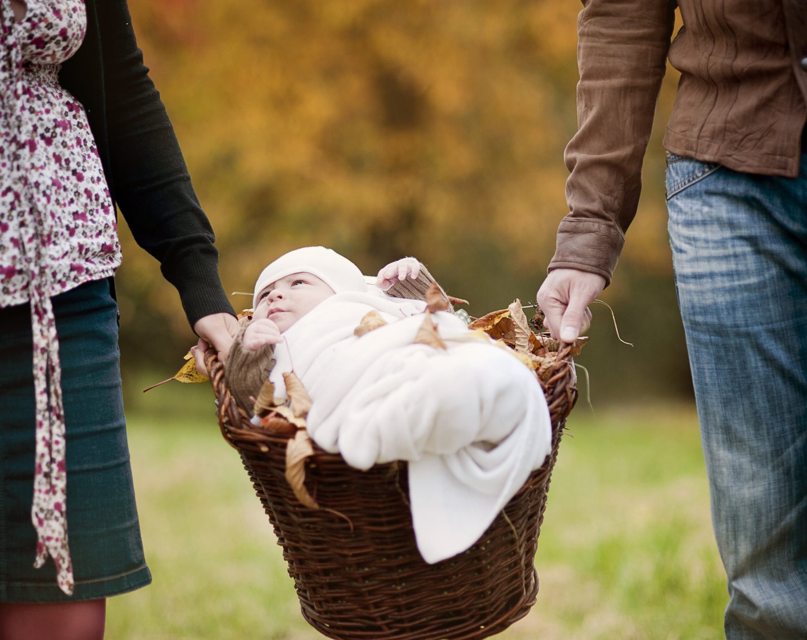 Family relaxing together in autumn nature